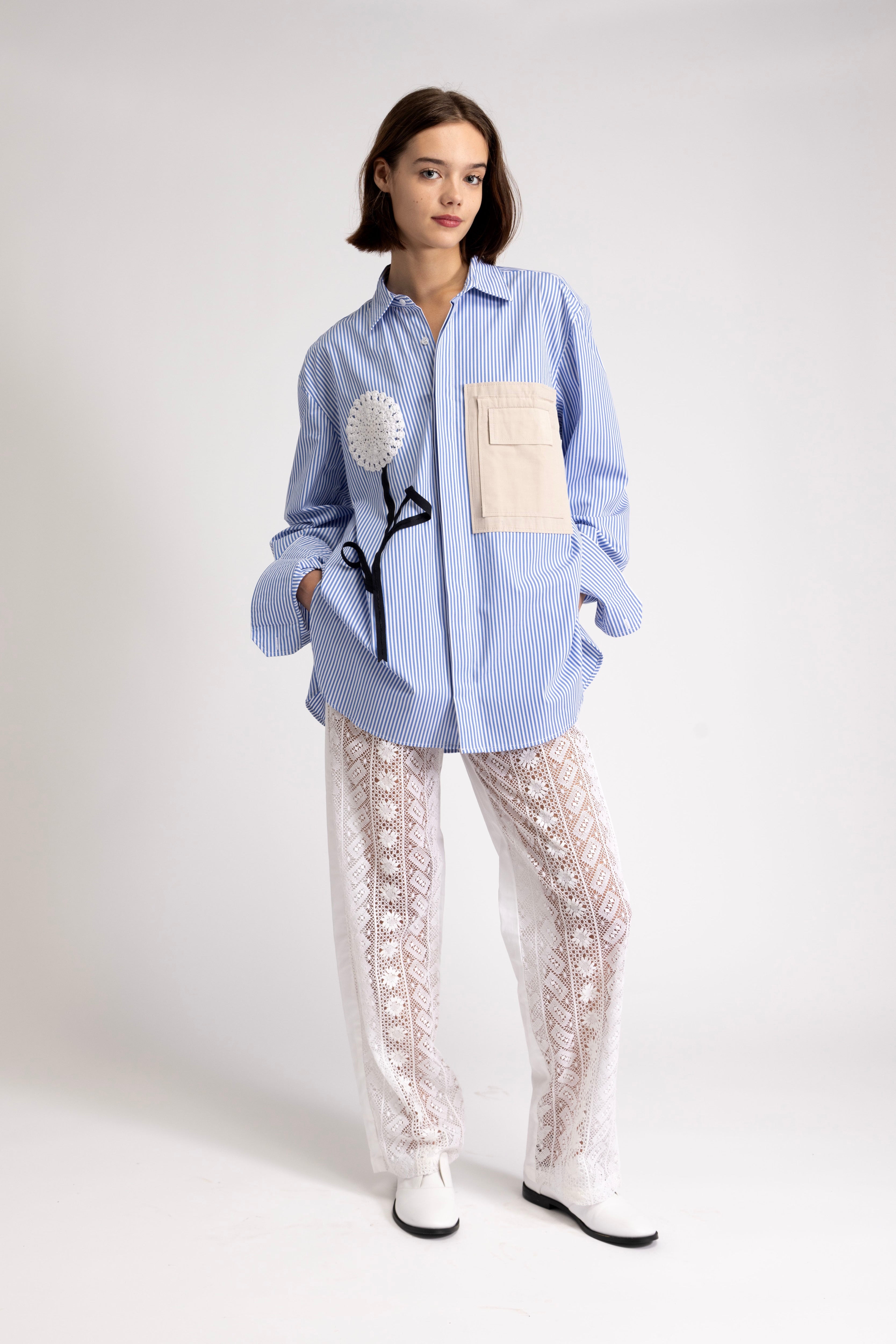 Women's oversized shirt with crochet flower appliqué