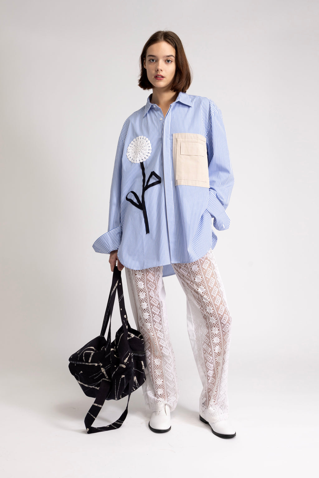 Women's oversized shirt with crochet flower appliqué