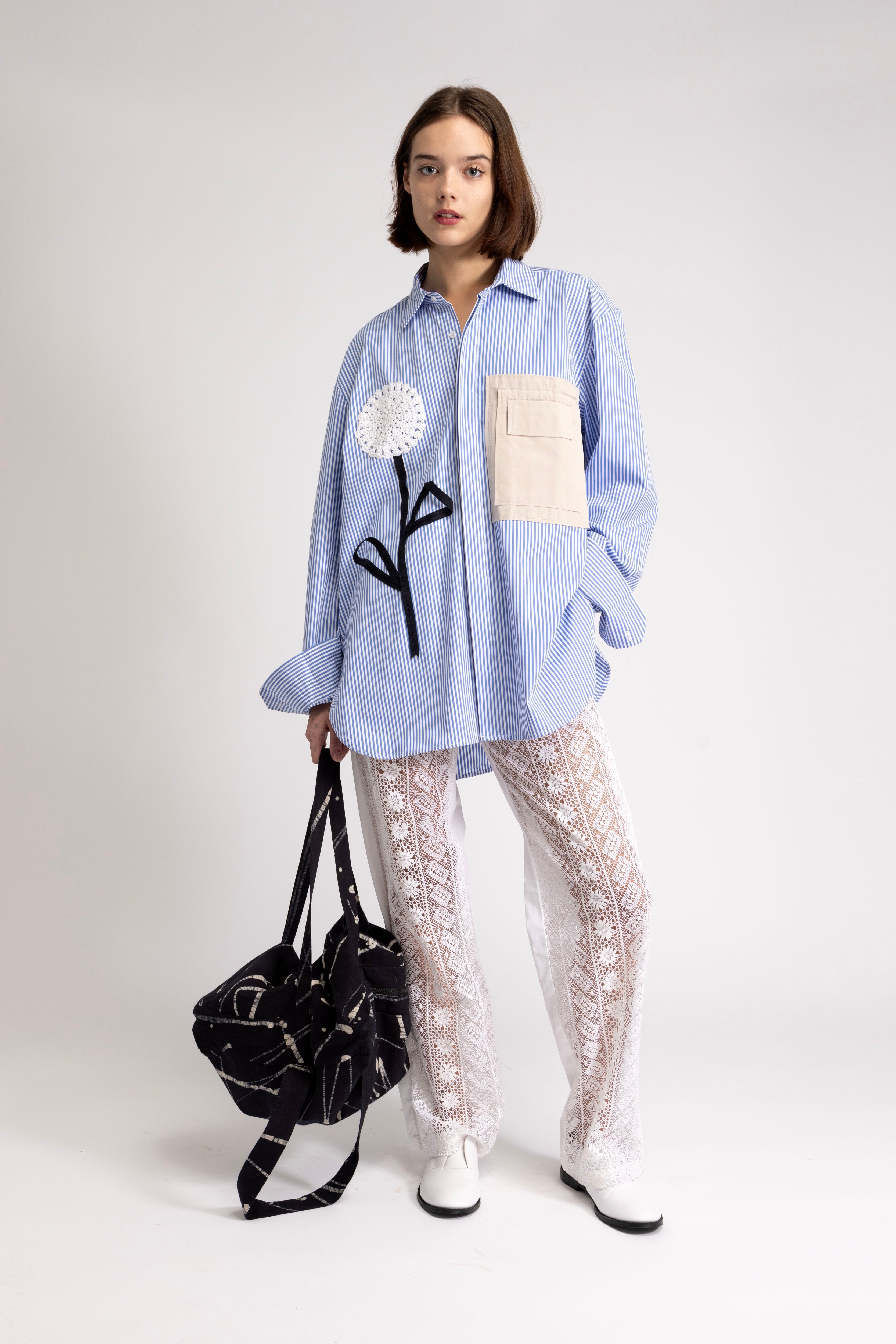 Women's oversized shirt with crochet flower appliqué
