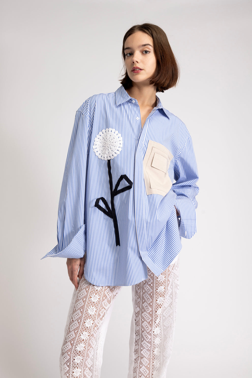 Women's oversized shirt with crochet flower appliqué